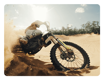 someone riding a dirt bike in the desert taken using a gopro camera