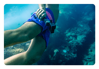 someone using the GoPro HERO12 Black underwater