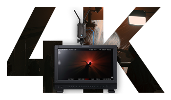 wireless hdmi transmitter and receivers connected to a monitor with 4K wrote behind it