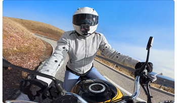 Motorcyclist riding with insta360 ace pro 2 action camera helmet mounted
