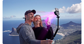 image of couple capturing selfie with Insta360 ace pro 2 camera on selfie stick above cape town bay