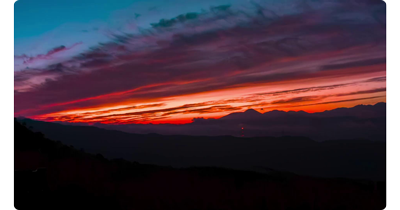 image of mountain landscape at bright orange sunset