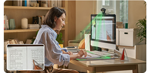 photograph of woman working at apple mac with insta360 link 2 in deskview mode