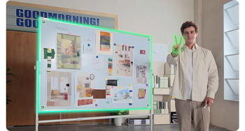 image of man holding hand in peace sign standing next to whiteboard