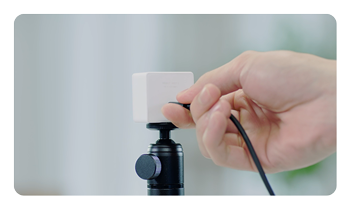 someone pluging in the OBSBOT Meet 2 4K webcam