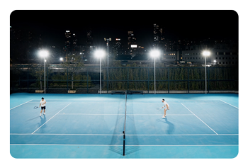 OBSBOT Tail 2 AI-powered camera nightview of a two tennis player on a court at night