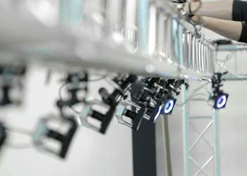 OptiTrack motion capture camera array on steel truss frame