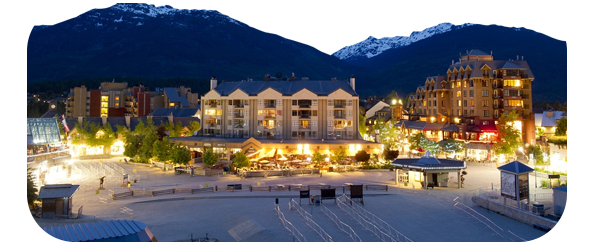 Panasonic S5 sample photograph of hotels light up at night infront of snow capped mountaines