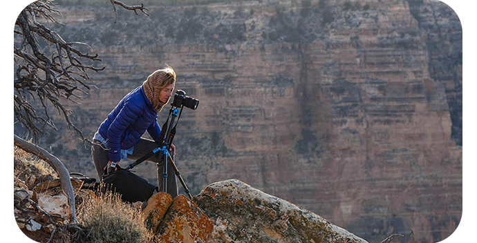 Female photographer looking through Lumix S1RM