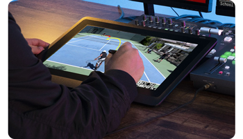 person drawing lines on wacom tablet annotating tennis game