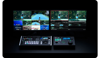 Two multiview monitors with Roland video switcher and replay editor on black desk