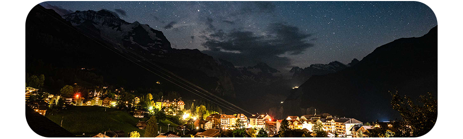 Sony a7 III sample image of alpine mountain town at night surrounded by mountain peaks