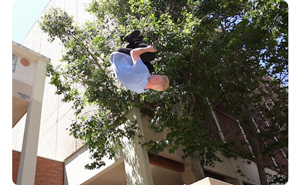 Image of parkour athlete performing front flip off a ledge