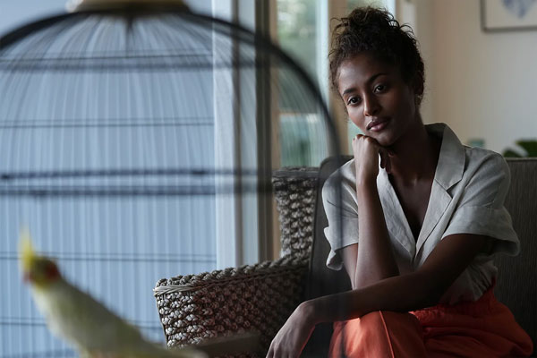 sample image of a woman sat on a chair taken with the Sony Alpha 6700