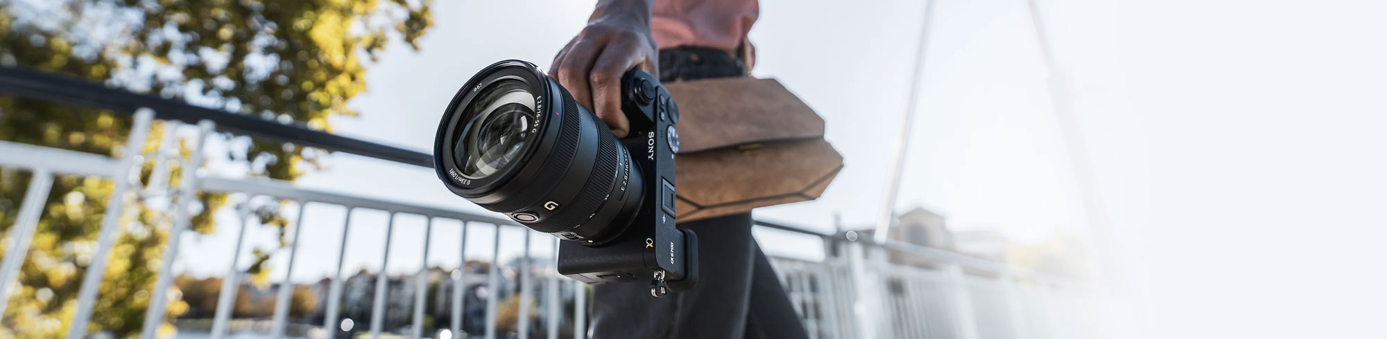 someone holding the Sony Alpha 6700