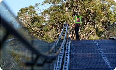Sony Alpha 6700 tracking a woman on a bridge