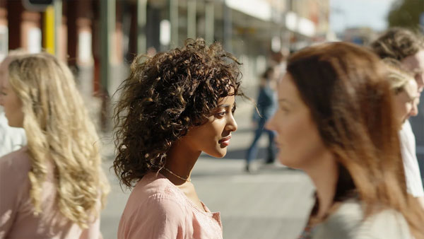sample image of a woman in a busy street taken with the Sony Alpha 6700