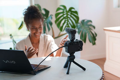 a woman using the Sony Alpha 6700 as a streaming camera