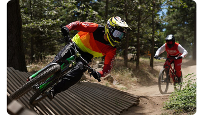 Sony E 16-55mm F2.8 G Lens sample image of mountain bike trail riders racing down trail