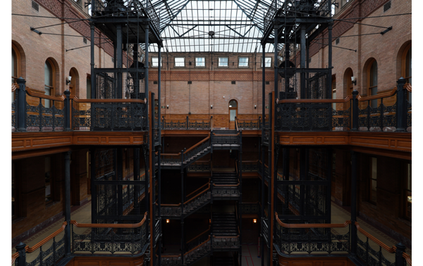 Sony E 16-55mm F2.8 G Lens Sample Images of a large old building courtyard staircases and elevators
