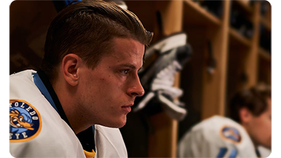 Sony FE 100m F2.8 STF GM OSS Lens sample image of Ice Hockey players sat in locker room