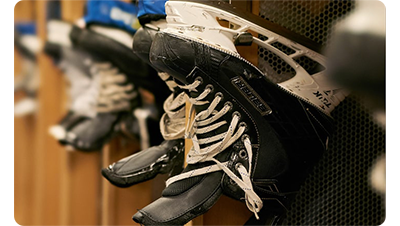 Sony FE 100m F2.8 STF GM OSS Lens sample image of hockey ice skates hanging in locker room