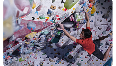 Sony FE 24-70mm F2.8 GM II Lens sample image of rock climber climbing an internal climbing wall
