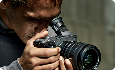 someone looking through the viewfinder of the Sony FX2