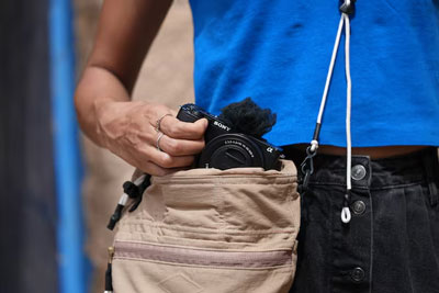 someone pulling the sony zv e10 ii out of their bag