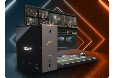 Vizrt TriCaster Mini Go with monitor and control surface with a geometric orange and blue lighting