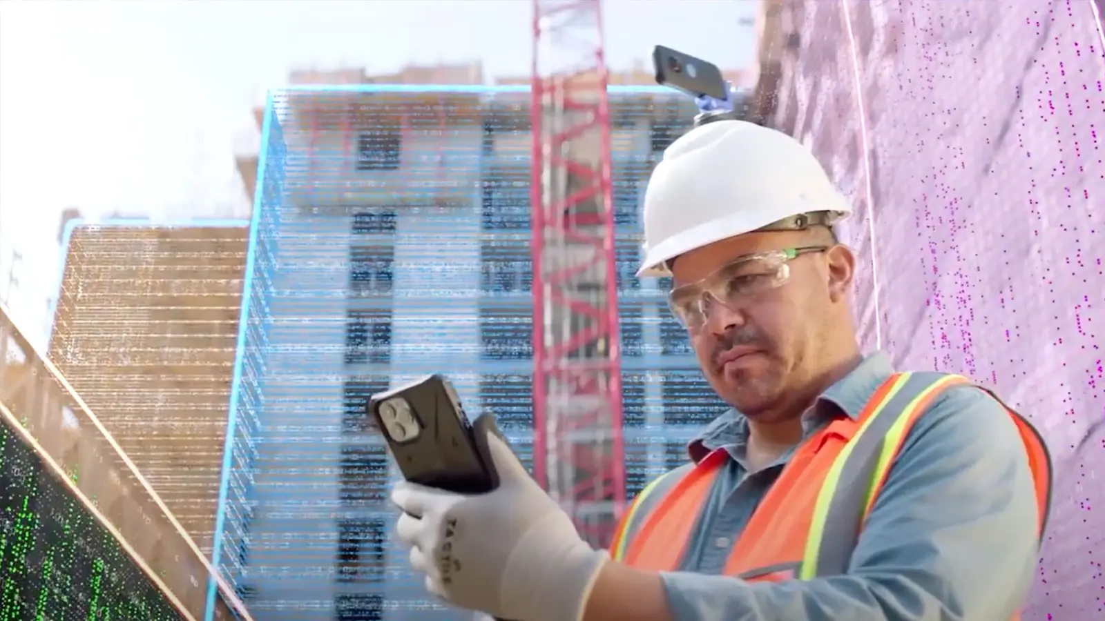 Construction worker using a mobile device on site with AI-assisted safety monitoring