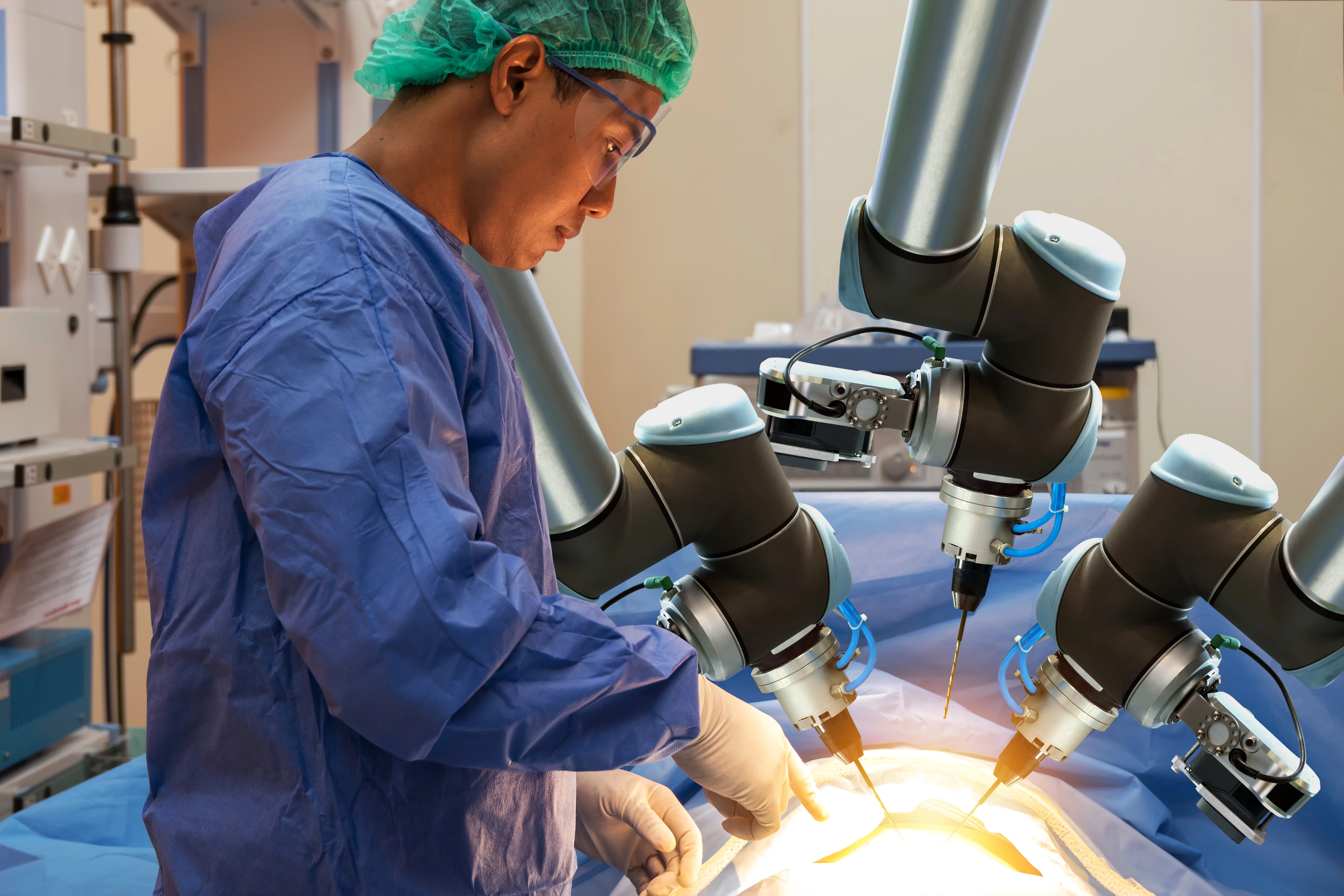 Clinical team performing a robot-assisted minimally invasive surgical procedure