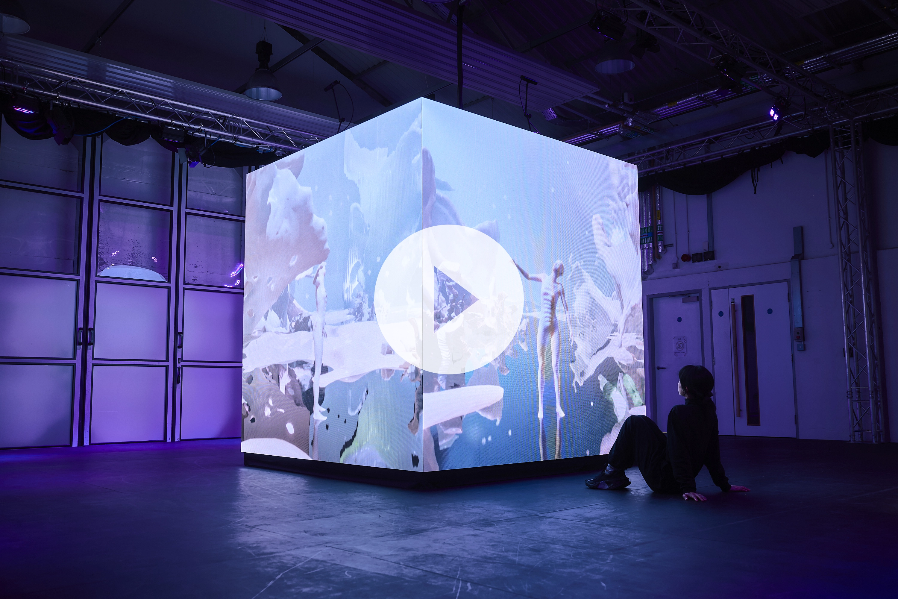 Behind-the-scenes documentary video thumbnail showing the LILITH.AEON LED cube setup and production process