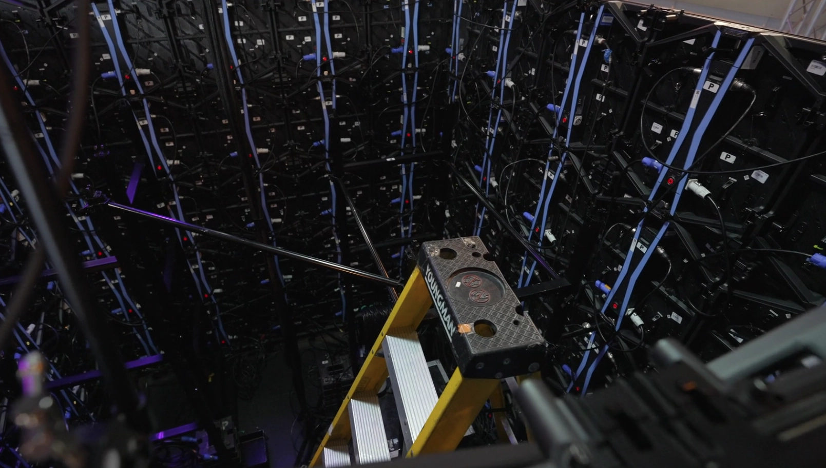 LED cube wall display showing AI-generated Lilith character during LILITH.AEON performance