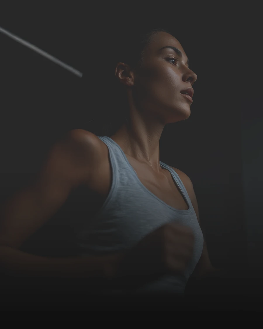 girl running on treadmil dark