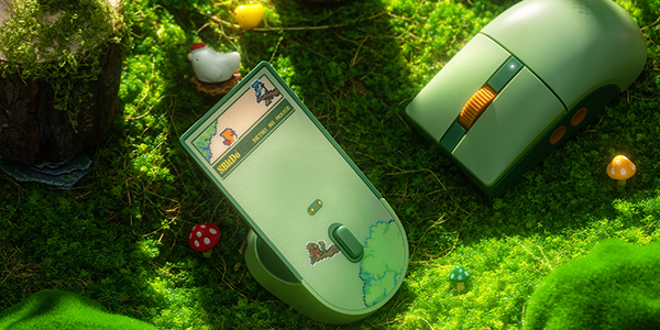 R8 mouse on a grassy surface beside its charging dock.
