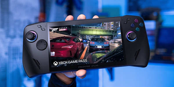 Hand holding Atlas 7 console with Forza on screen.