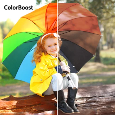 Child holding multicoloured umbrella, one half vibrant with ColorBoost text overlaid, other half dull.