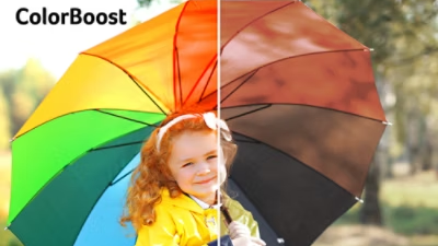 Girl sat with rainbow umbrella, one half rich and vibrant and other half desaturated.