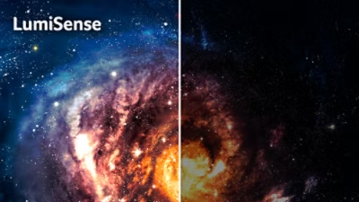 Galaxy in space, one half bright and colourful, other half darker and less visible. 