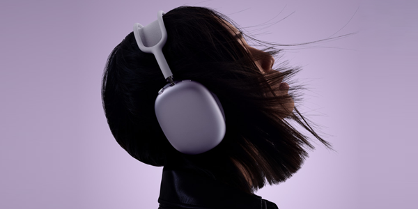 Person wearing AirPods Max 2 headphones with head tilted up slightly.