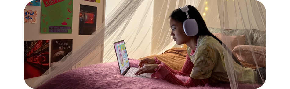 Lifestyle Image of a woman laying in her bedroom using the Neo Laptop