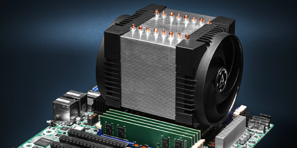 Cooler installed on a motherboard beside green RAM modules.
