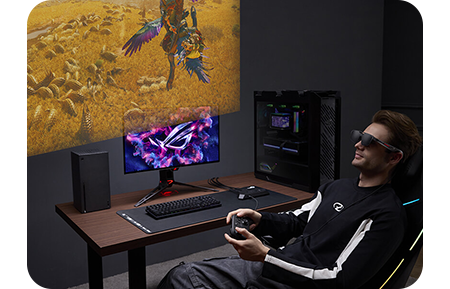 Lifestyle image of a man using the ROG XREAL R1 via a gaming PC