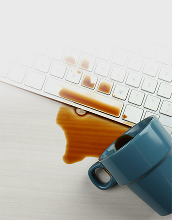 coffee spill on white keyboard