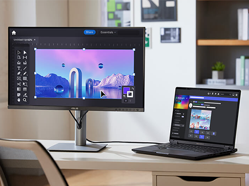 Laptop with chat program connected to monitor with graphics program
