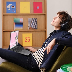 Student relaxing with headphones and laptop