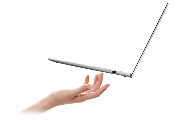 Side angle of a hand beneath the Vivobook S16.