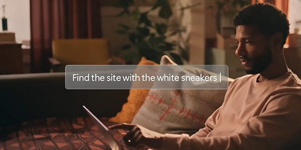 Man sat in living room using Vivobook S16.