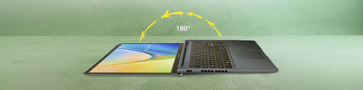 VivoBook open at 180 degrees laying flat on light green chalky textured surface.